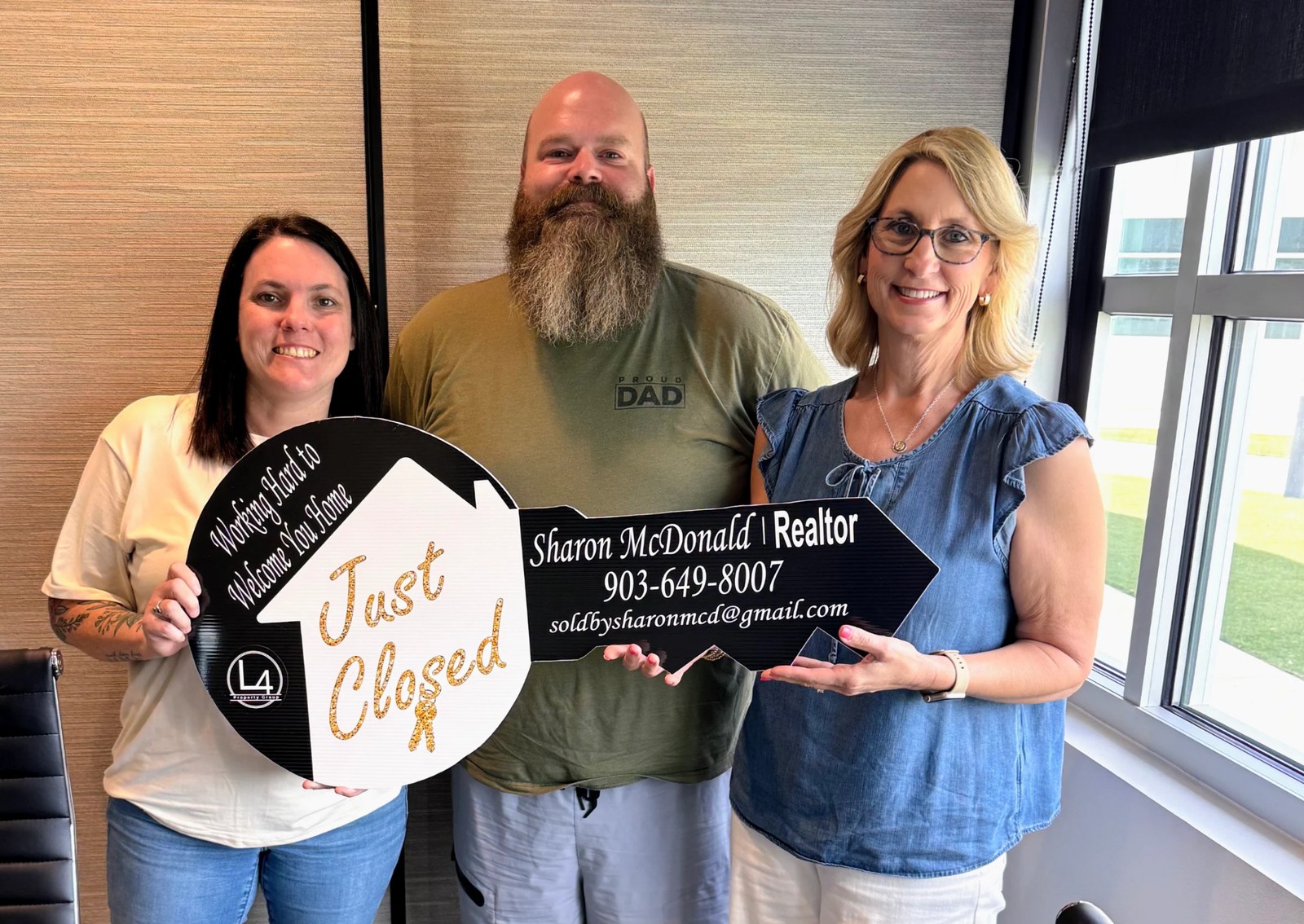 Sharon McDonald celebrating a closing with clients